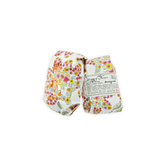 Two packs of floral-themed sanitary pads with colorful flower designs.