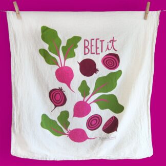 A white cloth with bright beetroot illustrations and the word 'BEET it'.