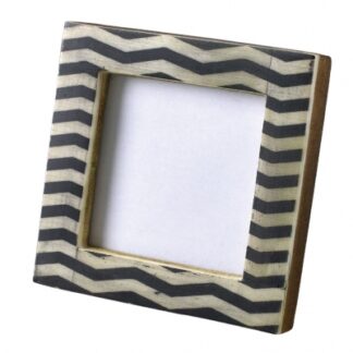 Square picture frame with black and white zigzag pattern.