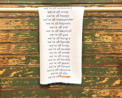 "We're All Human" dish towel