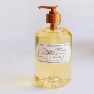 Clear liquid soap in a transparent pump bottle with a white label.