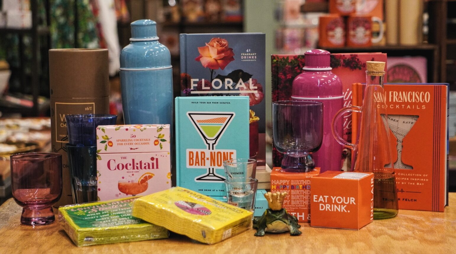 A colorful assortment of cocktail and bar-related items on a table.