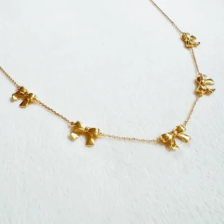 Delicate gold necklace with butterfly charms.