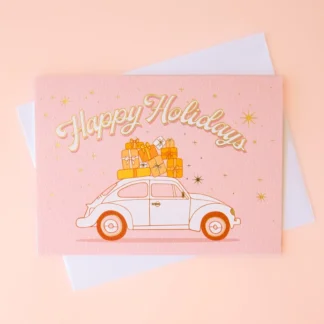 Pink wedding card with a car and couple illustration.