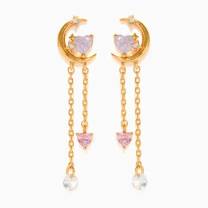 Elegant gold crescent moon earrings with dangling chains and gemstones.