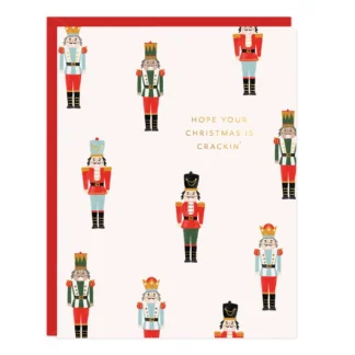 Festive card with various nutcracker illustrations on a white background.