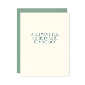 A minimalistic card reading 'All I Want for Christmas is Democracy'.