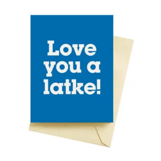 A blue card with white text saying 'Love you a latke!' and an envelope.