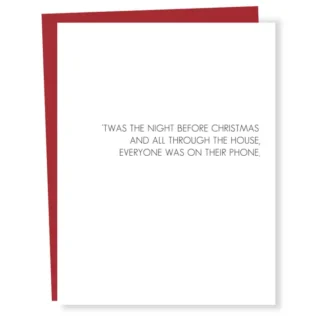 Minimalist Christmas card with simple text and red envelope.