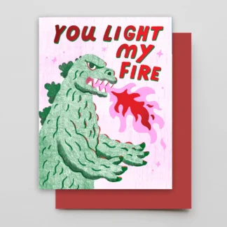 Monster breathing fire on greeting card.