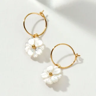 Gold hoop earrings with white flower charms