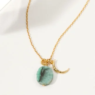 Gold necklace with turquoise stone and crescent